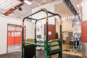 Horse examination stocks with a view through to the equine surgery suite in Glenwood Springs